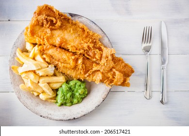 Traditional English Food - Fish And Chips With Mushy Peas