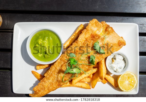 Traditional English Food such as\
Fish and Chips with green mushy peas served in the Pub or\
Restaurant