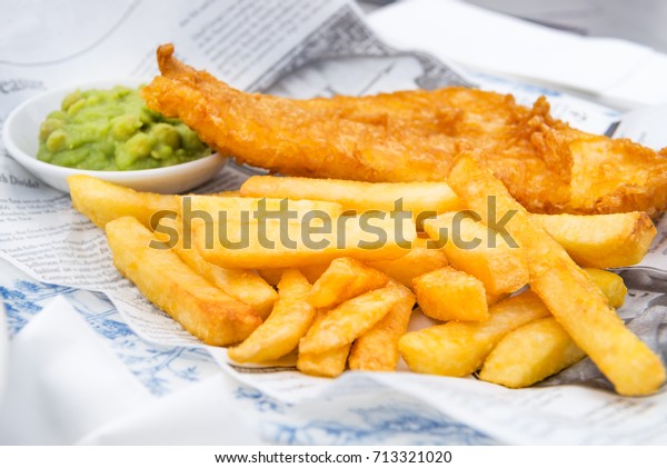 Traditional English Food such as Fish\
and Chips with mushy peas served in the Pub or\
Restaurant