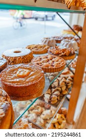 Traditional European Bakery Shop Interior, Cake Pastry And Bread Window Display, Pie, Chocolate Biscuit Cookie, Almond Bread