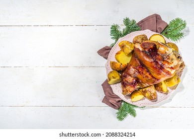 Traditional Festive Christmas Food, Baked Fried Pork Leg, Knuckle, Ham, With Potatoes And Spicy Herbs, Top View Copy Space 