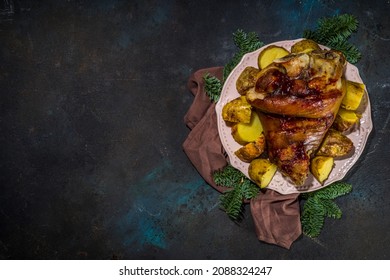 Traditional Festive Christmas Food, Baked Fried Pork Leg, Knuckle, Ham, With Potatoes And Spicy Herbs, Top View Copy Space 