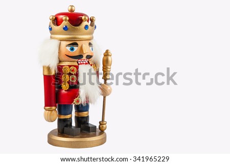 Traditional figurine christmas nutcracker wearing an old military style uniform. Christmas background