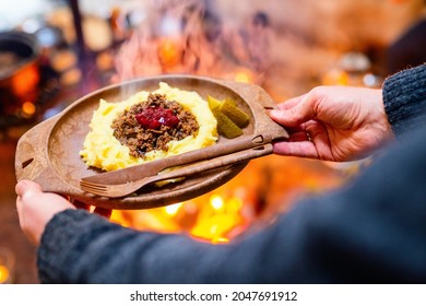 Traditional Finnish Food Sauteed Reindeer With Mashed Potatoes And Lingonberries Served In Lappish Hut Next To Open Fire