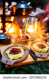 Traditional Finnish Food Sauteed Reindeer With Mashed Potatoes And Lingonberries Served In Lappish Hut Next To Open Fire