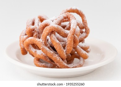 Traditional Finnish May Day Funnel Cake On The White Plate, Close Up. Tippaleipa.