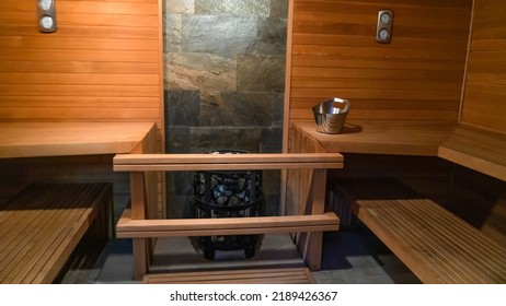 Traditional Finnish Sauna Made From Wood. Empty Interior Of Wooden Spa Cabin With Hot Dry Steam. The Finnish Sauna Is A Substantial Part Of Their Culture.