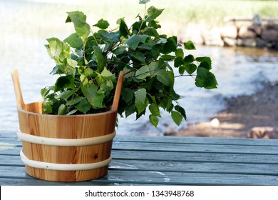 Traditional Finnish Sauna Whisk In Old Wooden Pail At The Waterside