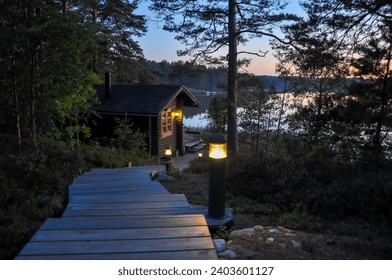 Traditional Finnish summer sauna and handmade wooden stairs in the archipelago 
