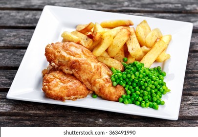 Traditional Fish And Chips With Peas.