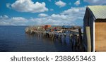 Traditional fishermen wooden jetties. Stilt piers or Cais Palafitico by the Sado River estuary during low tide on Carrasqueira, Alcacer do Sal, Setubal, Portugal