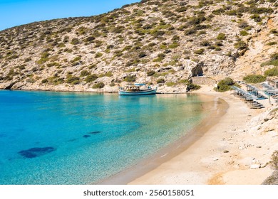 Traditional fishing boat anchoring in Maltezi bay with amazing beach, Amorgos island, Cyclades, Greece - Powered by Shutterstock