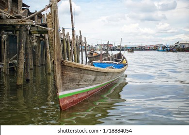 Traditional Fishing Boat Rests In A Fishing Village Near The Port Of Belawan