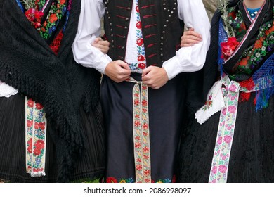 Traditional folk costumes worn by young people in Holloko village in Hungary, a UNESCO World Heritage site  - Shutterstock ID 2086998097