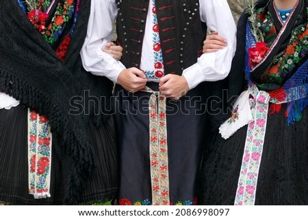 Traditional folk costumes worn by young people in Holloko village in Hungary, a UNESCO World Heritage site 