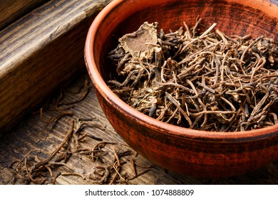 Traditional folk remedy from valerian roots in a mortar