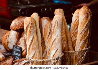 Traditional French Baguette and Country Bread in Bakery with Blurred Barista Coffee Machine Background - Powered by Shutterstock