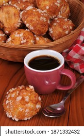 Traditional French chouquettes with a cup of coffee close-up