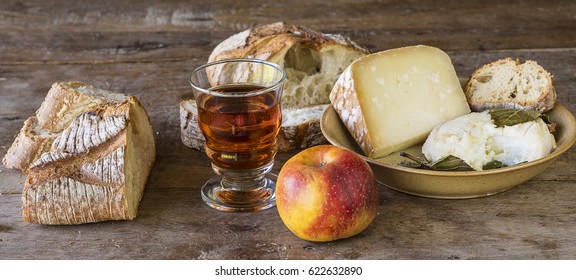 Traditional French Food In Country/different Cheese, Bread And Wine On Rustic Wooden Table