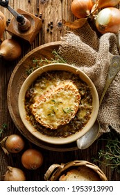 Traditional French Onion Soup Baked With Cheese Crouton Sprinkled With Fresh Thyme, Top View.