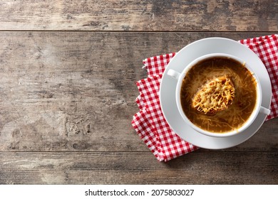 Traditional French Onion Soup On Wooden Table. Top View. Copy Sace