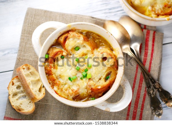 Traditional French onion\
soup with toasted baguette and melted cheese, dinner, supper,\
healthy homemade\
soup