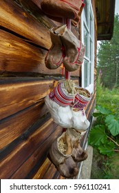 Traditional Fur Boots Of Sami People Hanging On A Wall