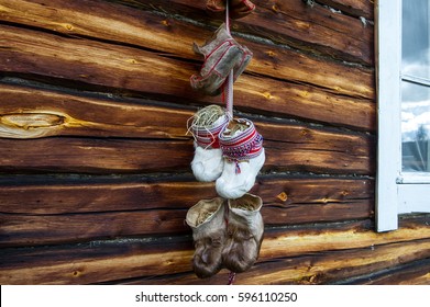 Traditional Fur Boots Of Sami People Hanging On A Wall