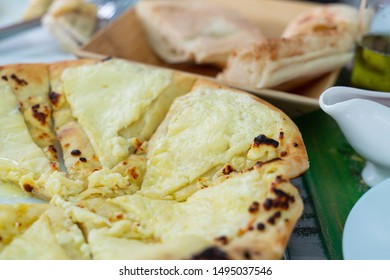 traditional Georgian dish of bread baked with cheese khachapuri close up. template for a cafe or restaurant menu. the design of the banner
