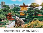 Traditional Golden Pavilion and Red Bridge in Lush Garden, Public Nan Lian Garden situated at Diamond hill, Hongkong