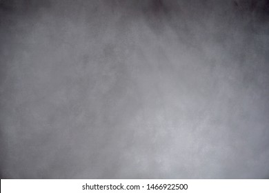 Traditional gray painted muslin or canvas fabric cloth studio background or backdrop