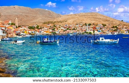 Traditional Greece fishing villages - charming  Chalki (Halki) island in Dodecanese. view with typical boats and colorful houses
