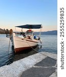 Traditional greek fishing boat with fighing nets in the aegean sea, Greece.