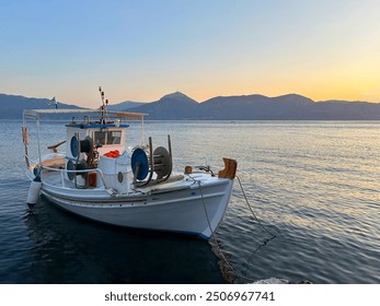 Traditional greek fishing boat with fighing nets in the aegean sea, Greece. - Powered by Shutterstock