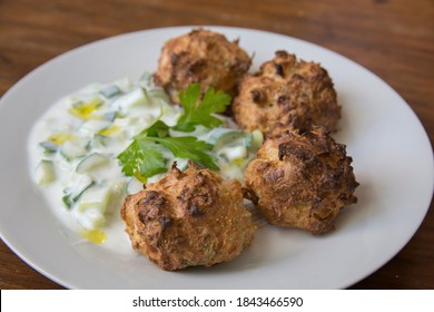 Traditional Greek Patties, Made Of Leek And Cheese, Served With Tzatziki Sauce In A Plate