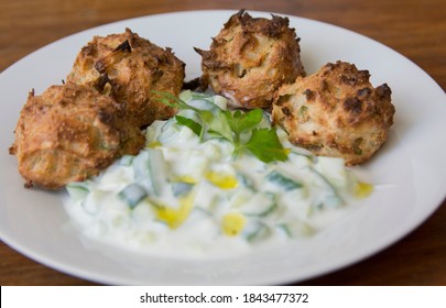 Traditional Greek Patties, Made Of Leek And Cheese, Served With Tzatziki Sauce In A Plate