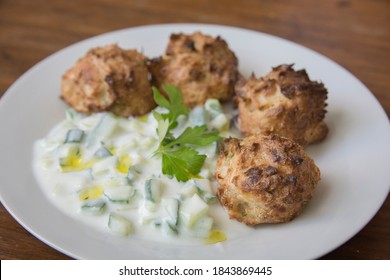 Traditional Greek Patties, Made Of Leek And Cheese, Served With Tzatziki Sauce In A Plate