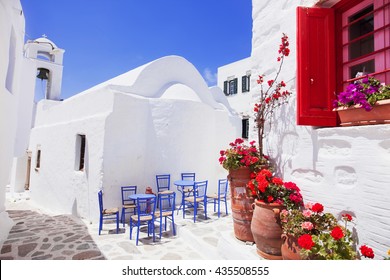 Traditional Greek Street With Flowers In Amorgos Island, Greece