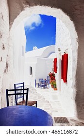 Traditional Greek Street With Flowers In Amorgos Island, Greece