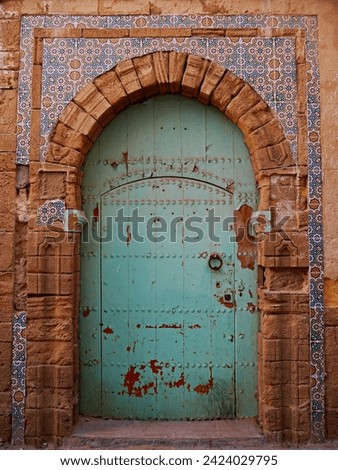 Traditional, green-painted Door with tiles, Essaouira, Morocco