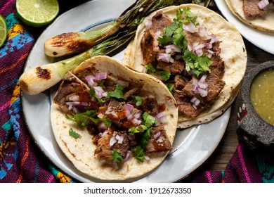Traditional grilled beef steak tacos on wooden background. Mexican food