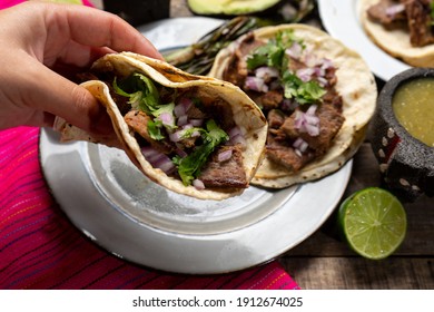 Traditional grilled beef steak tacos on wooden background. Mexican food