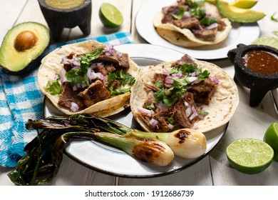 Traditional grilled beef steak tacos on white background. Mexican food