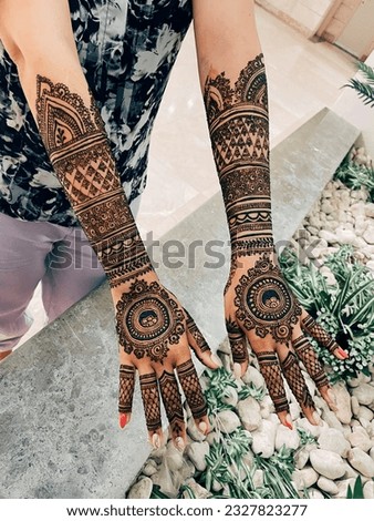 Traditional henna art tattoo on the hands. Bridal mehndi. Indian wedding tradition. 