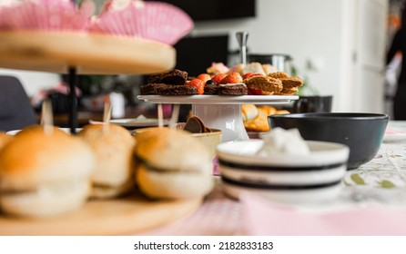 Traditional High Tea With Different Kind Of Cakes And Sweet Treats. Blueberries, Cake, Macarons, Strawberries And More. 