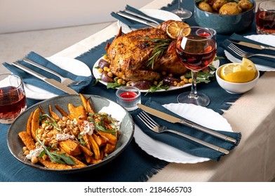 Traditional Holiday Dinner For Celebration Thanksgiving. Baked Chicken, Potatoes And Sides. Family Party Or Gathering. Fall Table Setting. Top View Table Scene