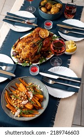 Traditional Holiday Dinner For Celebration Thanksgiving. Baked Chicken, Potatoes And Sides. Family Party Or Gathering. Fall Table Setting. Top View Table Scene