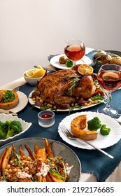 Traditional Holiday Dinner For Celebration Thanksgiving. Baked Chicken, Potatoes And Sides. Family Party Or Gathering. Fall Table Setting. Top View Table Scene