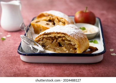 Traditional homemade apple strudel with almond flakes