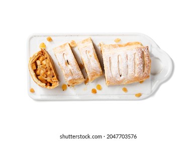 Traditional homemade apple strudel with caramelized apples and raisins. isolated on white background. top view